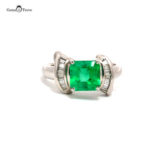 Platinum Muzo emerald ring with baguette diamonds
