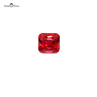 Close-up of a faceted Mahenge spinel gemstone, showcasing its rich hues on a white turntable.