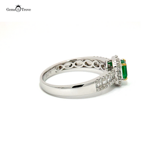 Octagonal emerald engagement ring with side diamonds on white gold 