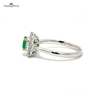 Crown-style emerald ring with diamond halo on gold
