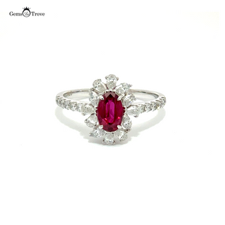 Vintage oval ruby ring with natural diamonds, set in 18K solid gold, showcasing a purplish-red stone, eye clean clarity.