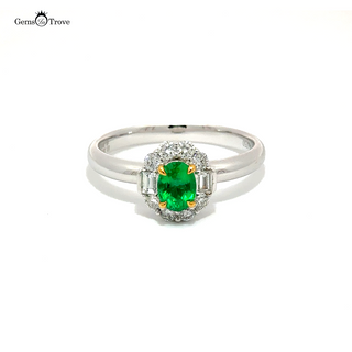 Oval Afghan emerald ring with diamond halo on gold band