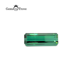 A rectangular green tourmaline gemstone weighing 27.87ct, displayed on a clean white background.