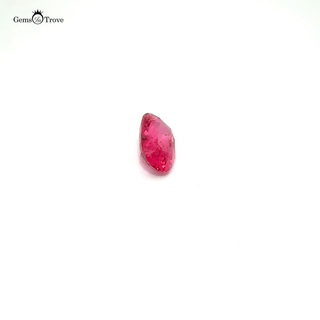 A rare pink spinel in an oval cut, captured in high-resolution against a white background.